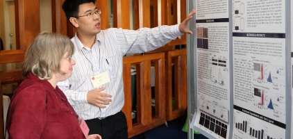 Toronto_POGO-Symposium_Researcher_demonstrating-poster-board